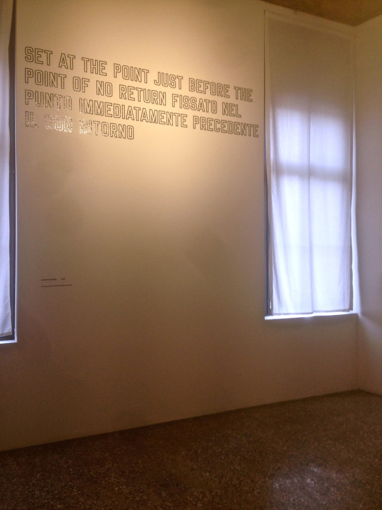 Performance invisible n° 36 (Insérer discrètement des autoportraits photographiques dans des catalogues et des lieux d’exposition). D'après Jonathan Monk. Lost In Your Head. ? Lawrence Weiner. SET AT THE POINT JUST BEFORE THE POINT OF NO RETURN. ? Personal Structures. Palazzo Mora 56. Esposizione Internazionale d’Arte. Biennale di Venezia 2015. Performeurs : Patrice Loubier et Steve Giasson. Crédit photographique : Patrice Loubier.